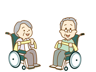 車いすの高齢者　セラバンドを使用して筋肉トレーニング