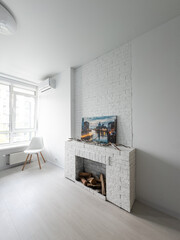 studio in minimalist style, fireplace, sofa
