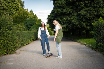 Friends enjoy a sunny afternoon skating and laughing in the park