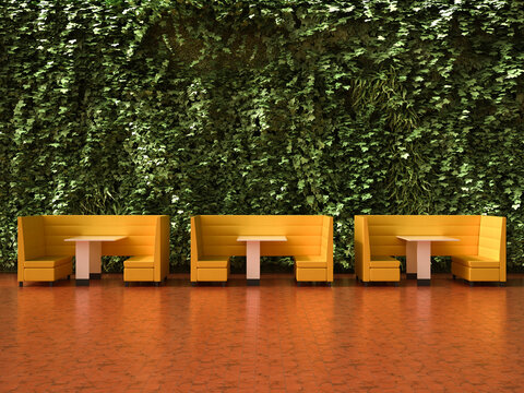 Modern lobby interior with yellow booths and a lush vertical garden wall