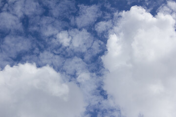 The sky is covered with fluffy clouds.