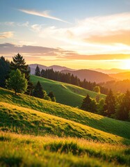 Obraz premium Rolling green hills illuminated by the golden light of a sunset, with scattered trees and distant mountains under a colorful sky