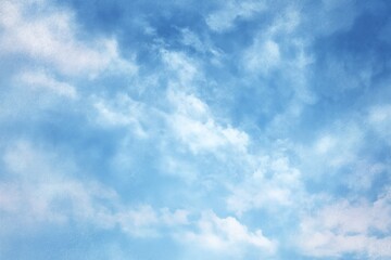 Fototapeta premium Soft Blue Pastel Sky with Puffy White Clouds