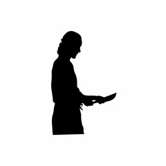 Silhouette of a woman preparing vegetables for pickling