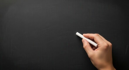 Hand holding white chalk writing on a dark textured blackboard drawing
