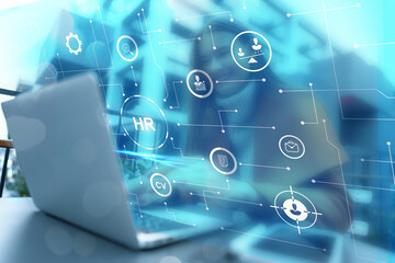 Human resources management software dashboard displayed on a laptop screen in a modern office...