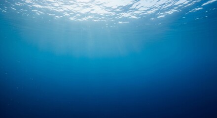 Underwater view of sunlight filtering through the ocean surface