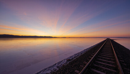 Rustic Railroad Track Leading to A Stunning Sunset View