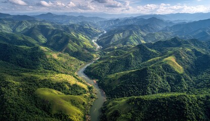 Obraz premium Lush green mountains surrounding a winding river