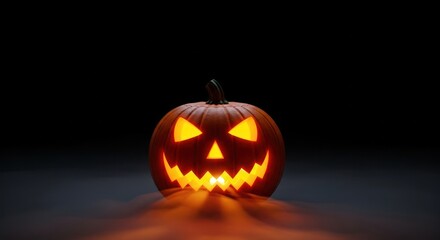 Glowing jack o lantern with spooky face on dark background for halloween