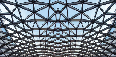 Architectural glass structure with a geometric triangular pattern, Steel glass roof wall construction transparent window with support system