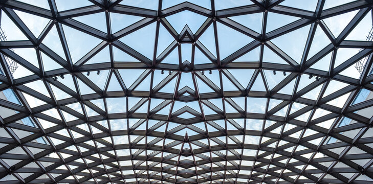 Architectural glass structure with a geometric triangular pattern, Steel glass roof wall construction transparent window with support system