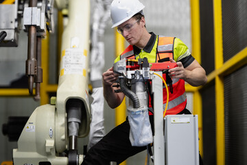 Smart Caucasian engineer work setup AI automated in robotics electronics engineering laboratory. Technician inspector maintenance repair check robot arm machine in artificial intelligent laboratory.