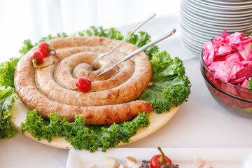 delicious Ukrainian food on the table, homemade sausage 