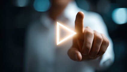 Close-up hand pressing play button