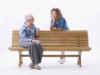 Caregiver and senior woman talking together