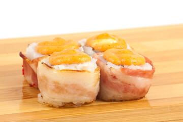 Delicious Sushi Rolls with Crispy Bacon and Spicy Sauce