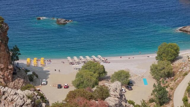 Drone reveals Achata Beach at Karpathos Island, showing turquoise blue waters, sandy shore, and the stunning Mediterranean coastline.