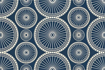Intricate geometric pattern of stylized spoked wheels in white and blue creating a repeating decorative textile design
