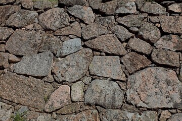 Closeup of old stone wall background texture.