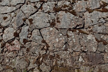 Closeup of old stone wall background texture.