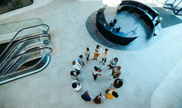 Corporate team meeting in modern reception area