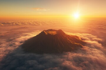 A dramatic volcano peaks above a sea of clouds at golden sunset.
