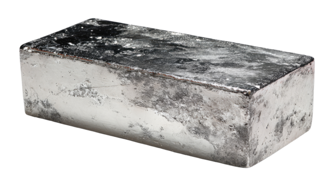 Rectangular, heavy, metallic ingot.  Rough, mottled gray surface