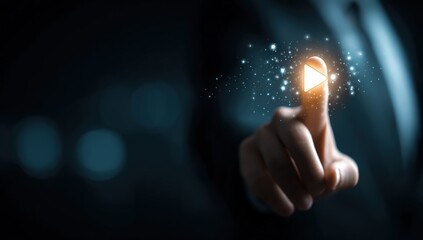 Close-up of a hand pressing a play button