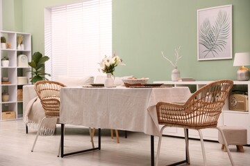 Stylish table with chairs and decor in dining room. Interior design