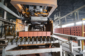 Automated brick production concept. Drying and transporting bricks on conveyor belt in factory