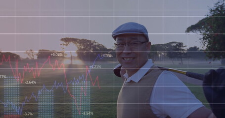 Smiling Chinese golfer holding golf club on fairway at sunrise, in flat cap, copy space