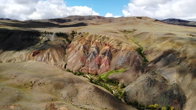 Kyzyl-chin valley shifting shadows over colorful mountains. Media