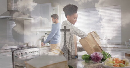 Unpacking produce female home cook taking items from paper bag on marble kitchen island, copy space