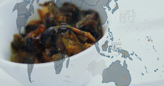 Combining white ceramic bowl holding dark cooked pieces sitting in studio, with world map overlay