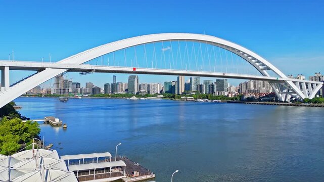 4K Real Time Aerial view of Lupu bridge and Huangpu River in Shanghai on sunny day.