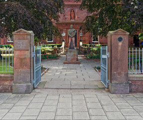 The Arbroath Library situated on Hill Terrace, an old Building built of Red Sandstone, with an impressive statue of Robert Burns at the Entrance.