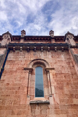 Fototapeta premium COVADONGA, SPAIN - APRIL 6, 2025: Covadonga in Asturias is a historic mountain village known for its sacred cave, basilica, and stunning natural surroundings.