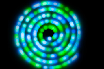 Abstract blue green lights in spiral circle, abstract holiday background