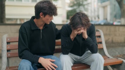 Teen comforting his sad friend outdoors, showing empathy and emotional support - Powered by Adobe