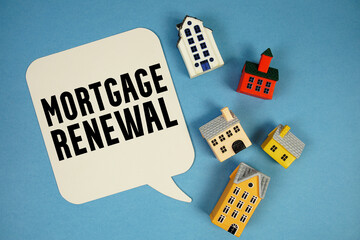Mortgage Renewal text with house models on blue background