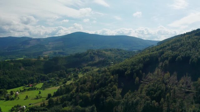 Right drone shot of Beskydy mountains over trees and forest