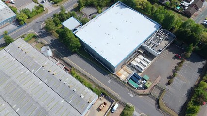 Cinematic aerial drone orbit of large data centre with IT infrastructure, cooling systems and cloud storage facilities Nottingham England UK - Powered by Adobe