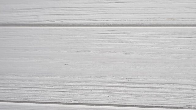 White painted wooden planks forming a textured, rustic background, suitable for various design and presentation needs video 4k