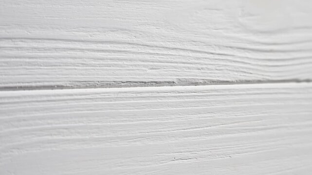 White painted wooden planks forming a textured, rustic background, suitable for various design presentation needs video 4k