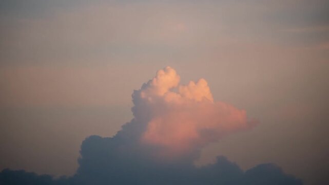 Serene Sunset Sky with Soft Clouds