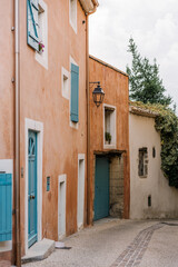 Cozy street of old Provençal town in soft sunset light, romantic Mediterranean atmosphere.