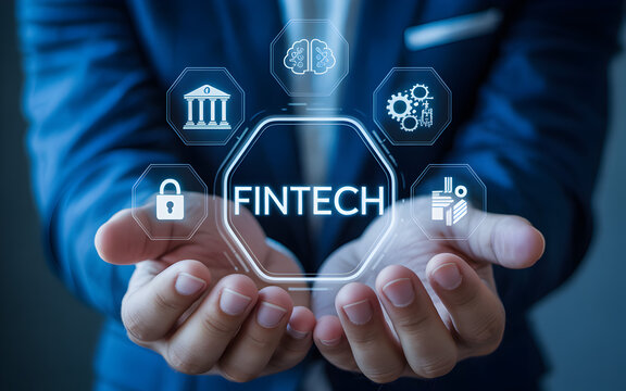 Hands holding a glowing hexagon with the word fintech and financial icons