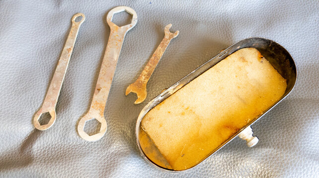 old toolbox with tools for french vintage moped ancient parts