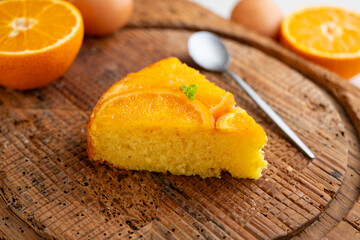 Orange upside-down cake. Delicious homemade sponge cake with organic orange slices.